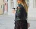 woman holding disposable cup